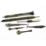Silver cased propelling pencil, another plated pencil and various buttonhooks etc.