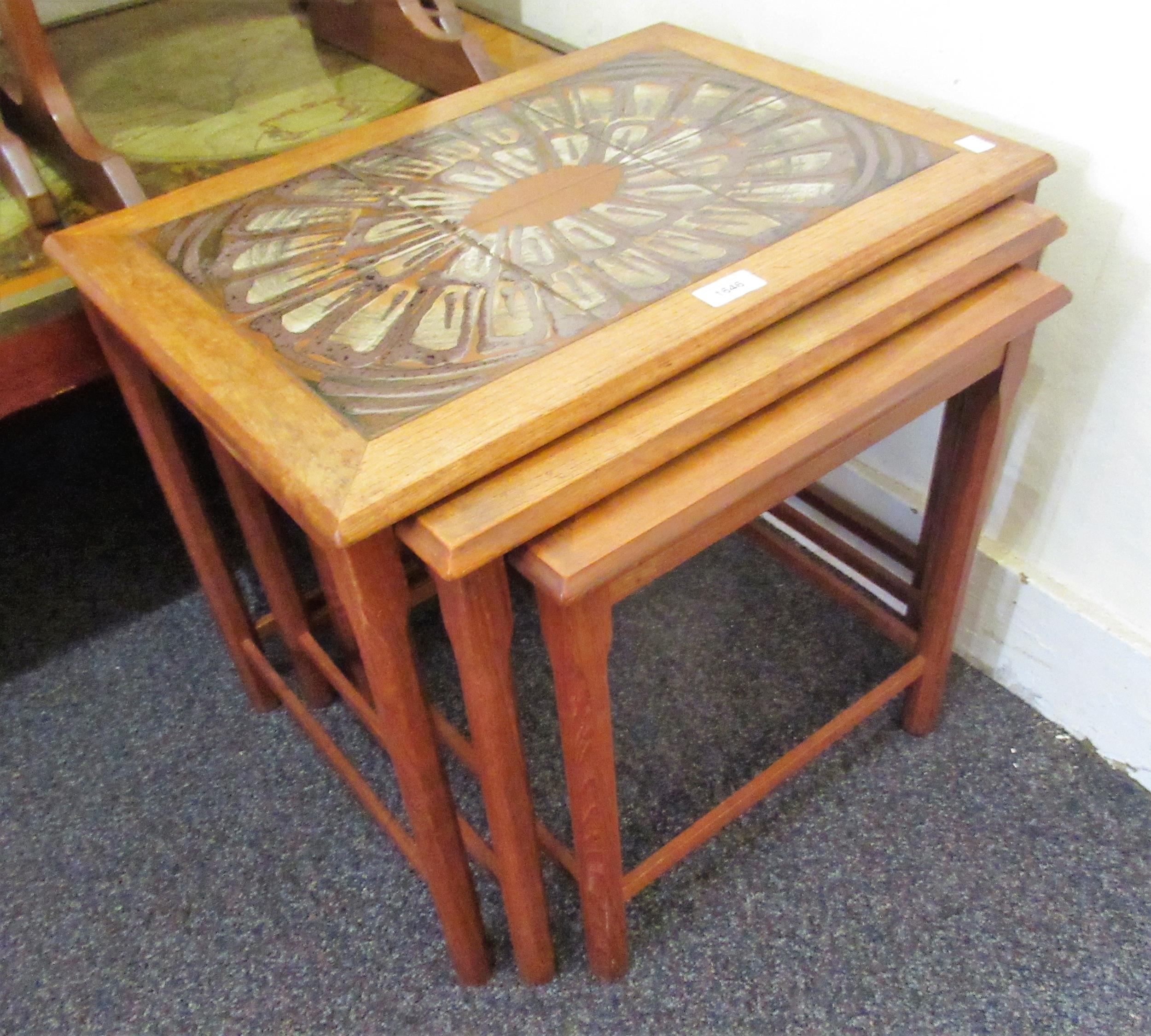 Nest of three mid 20th Century Danish teak occasional tables with tile inset tops, 55cms wide