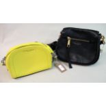 Marc Jacobs Recruit black leather crossbody bag together with a yellow Marc Jacobs Playback