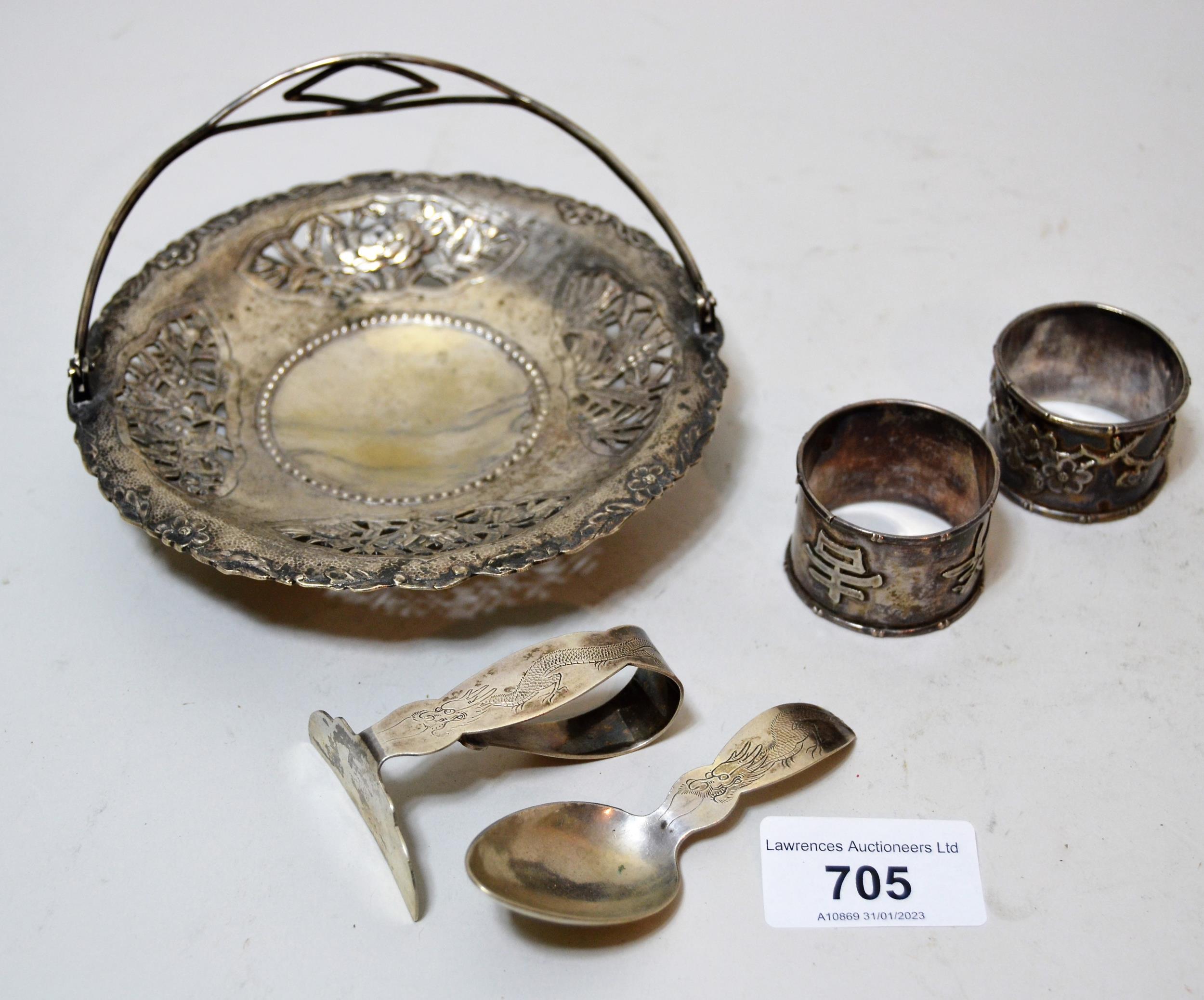Small Chinese circular sterling silver swing handled dish, two napkin rings and a babies spoon and