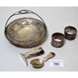 Small Chinese circular sterling silver swing handled dish, two napkin rings and a babies spoon and