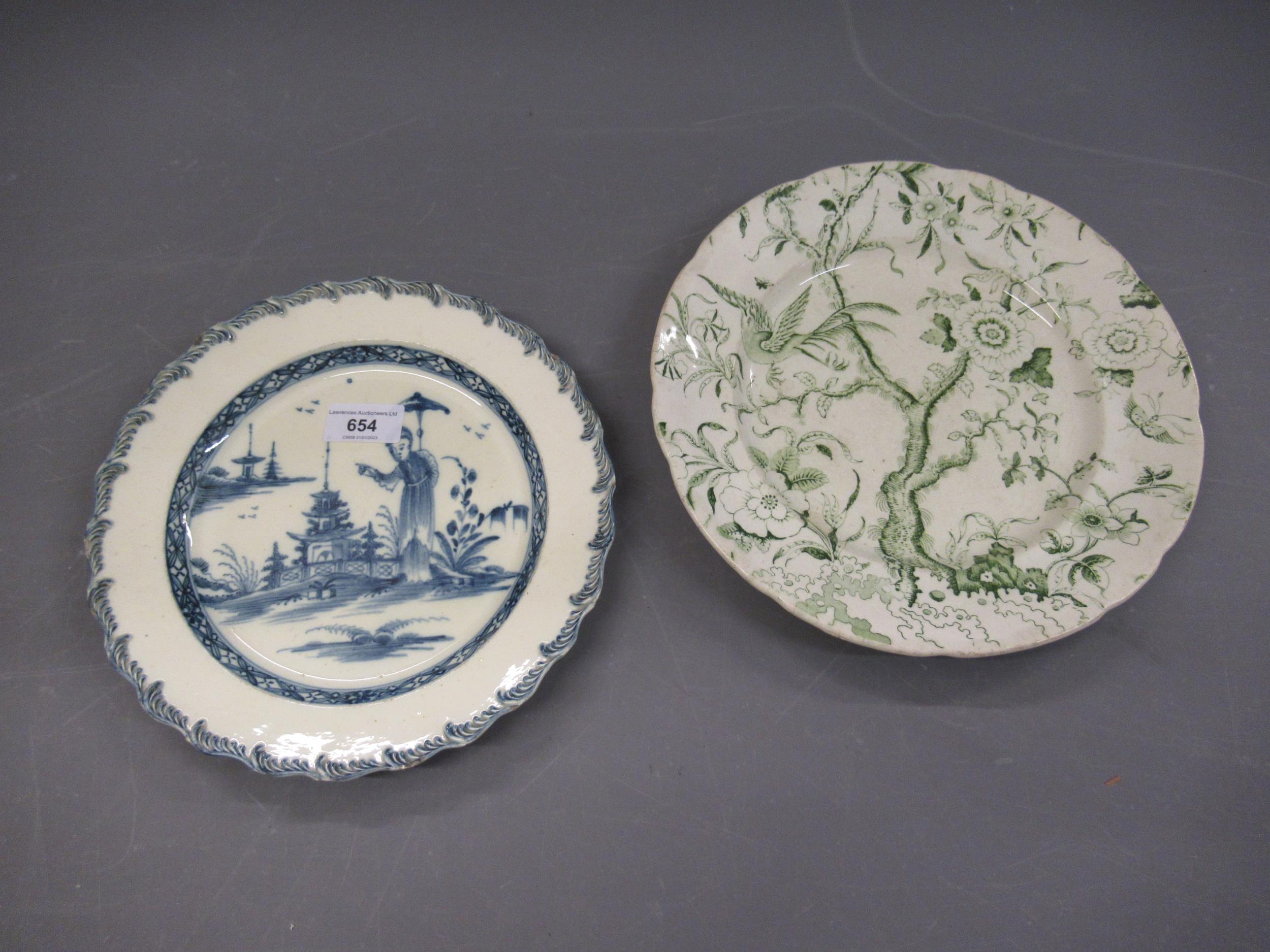 18th Century English Creamware plate decorated in blue and white with a Chinoiserie pattern, 24cms