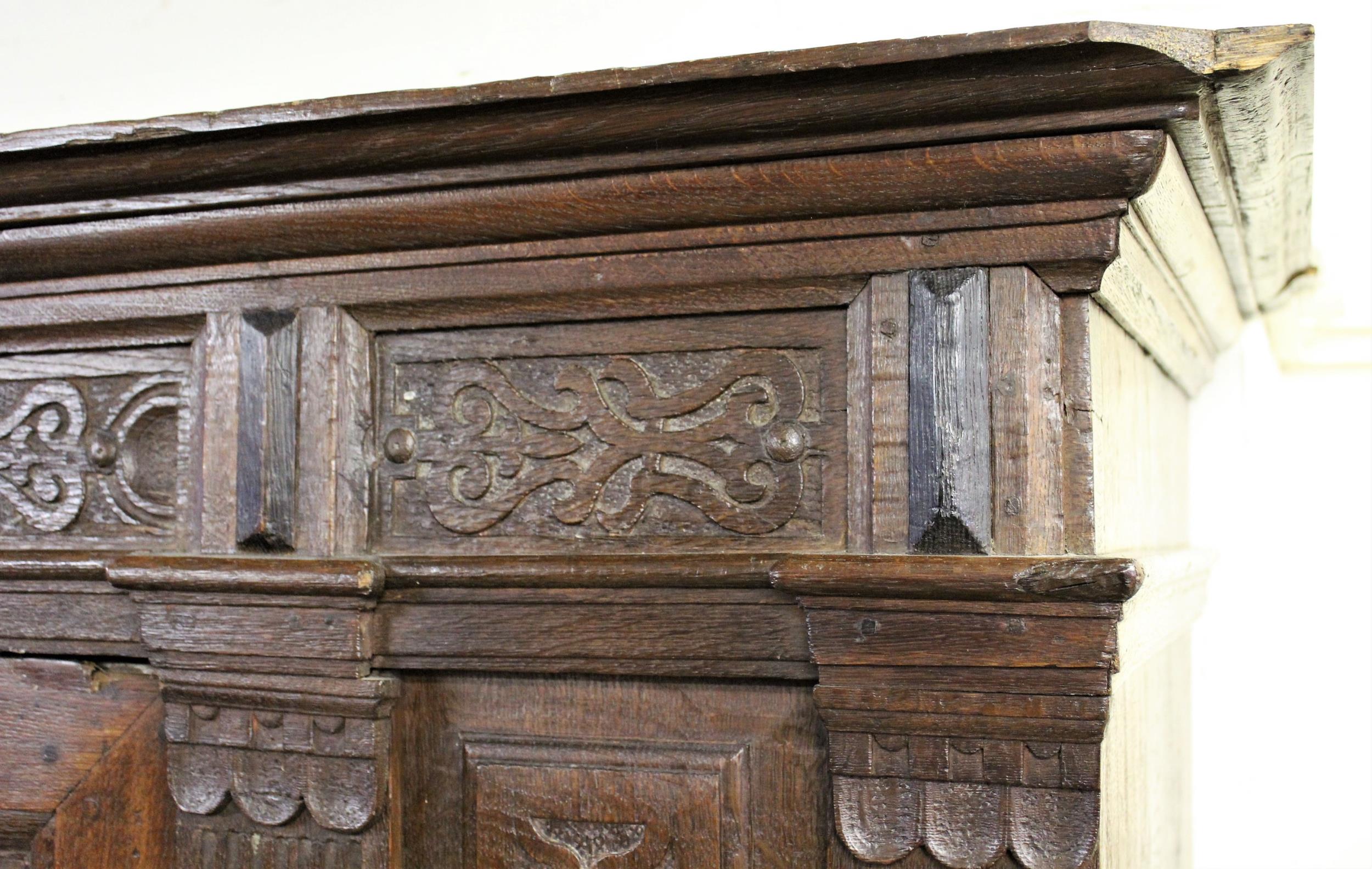 Continental oak armoire, the moulded cornice above a pair of carved fielded panelled doors flanked - Image 2 of 5