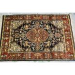 Small Indo Persian rug with a medallion and hunting design on a blue ground with rust ground