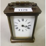 20th Century brass cased carriage clock with enamel dial, Roman numerals and single train