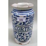 Italian tin glazed earthenware albarello decorated in blue and white and inscribed ' Cortic: