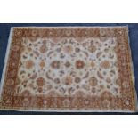 Afghan carpet of Ziegler design with an all-over palmette pattern on an ivory ground with borders,