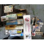 Two boxes containing a large collection of various model aircraft kits and model boat kits,