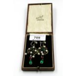Pair of silver drop earrings in Renaissance style set freshwater pearls, garnet and green paste