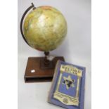 Philips 9in terrestrial globe on stand, the mahogany rectangular base housing an atlas, 44cms high