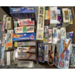 Two boxes containing a collection of various model aircraft kits, including Airfix, Revel, Heller,