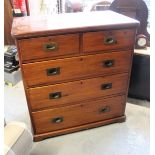 Victorian stained pine military type straight front chest of two short and three long drawers,