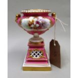 Royal Worcester, two handled pedestal vase, painted with a panel of orchids on pink and gilt ground,
