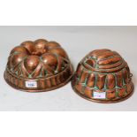 Large 19th Century circular copper mould, 26.5cms diameter together with another similar, smaller
