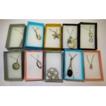 Ten various boxed silver pendants on chains