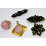 Yellow metal mounted rose quartz ball form pendant, another similar pendant and two items of