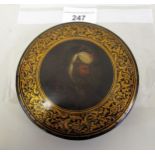 19th Century circular papier mache snuff box, the cover painted with portrait of a Turk Some