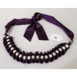 Carolina Herrera, purple ribbon necklace with simulated pearl decoration