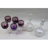 Pair of good quality cut glass decanters with stoppers, together with a set of five Bohemian mauve
