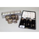 Cased set of six Sheffield silver coffee spoons, together with three various silver napkin rings,