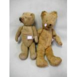 Two jointed plush covered teddy bears (both at fault)