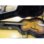 Late 1950's arch top acoustic guitar by Hofner with later case (damage to neck heel)