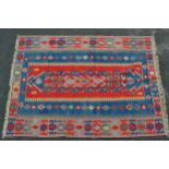 Kelim rug in shades of red, blue, pink and beige, 250cms x 186cms