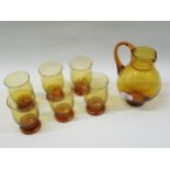 Dutch amber glass jug with six matching glasses by Leerdam