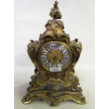 19th Century French ormolu mantel clock of rococo design, the shaped case with a gilt dial and