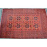 Modern Afghan Belouch carpet with two rows of four gols and an all-over stylised floral design on