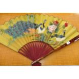 Large Chinese lacquered fan, painted with exotic birds