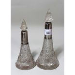 Two silver mounted and cut glass perfume bottles, with stoppers