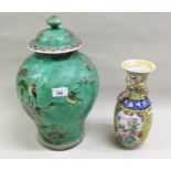 Large 19th Century Chinese famille verte temple jar and cover, decorated with flowers and birds on a