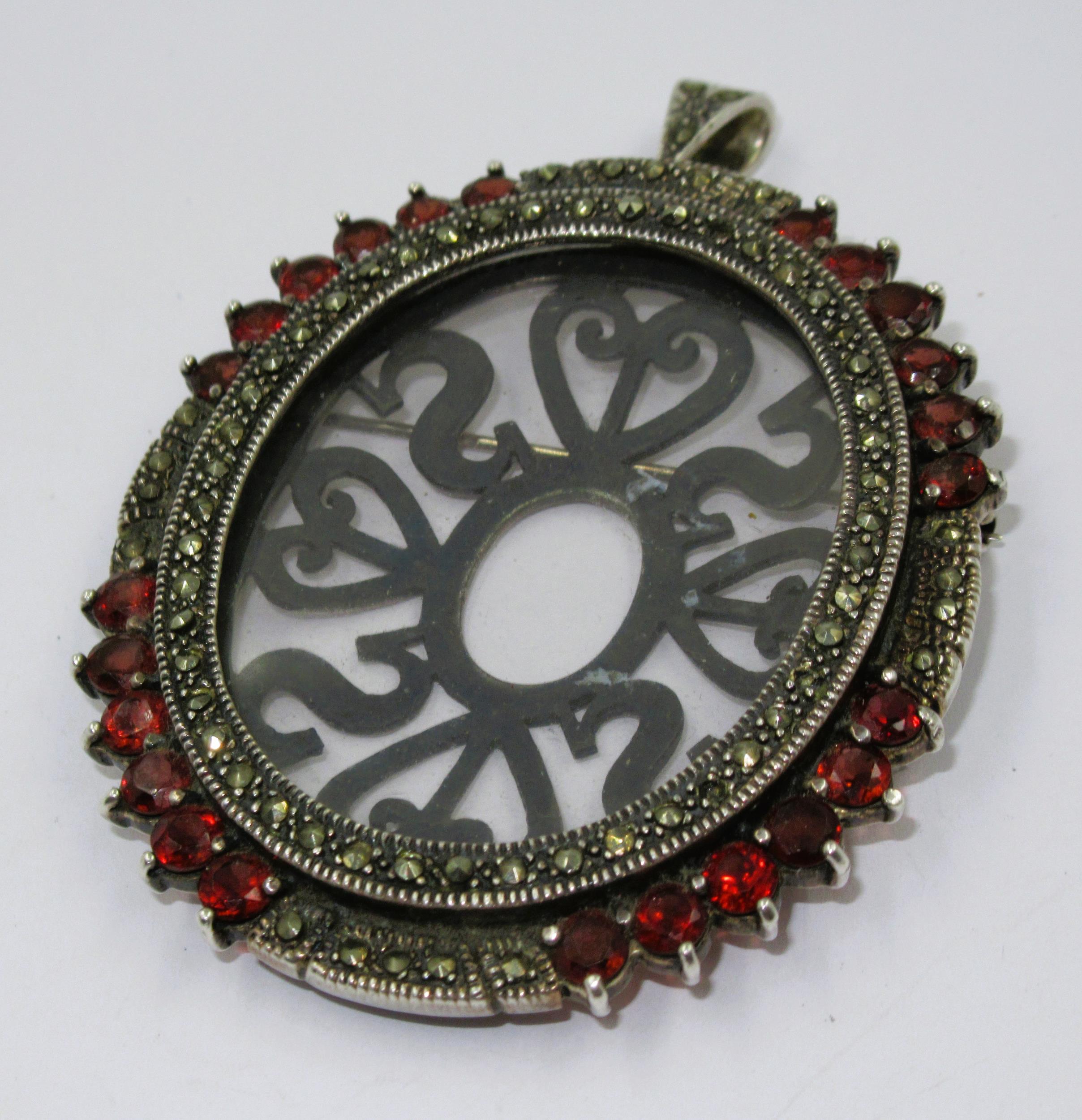 Silver garnet and marcasite mounted oval portrait pendant