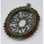 Silver garnet and marcasite mounted oval portrait pendant