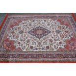 Machine woven rug of Persian design in shades of cream and pink, 231cms x 169cms