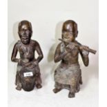 Two large 20th Century cast bronze patinated figures of seated African musicians, 32cms high each