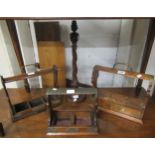 Three early 20th Century oak tantalus frames, together with a spiral turned table lamp None of the