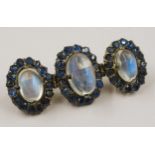 Silver bar brooch set three oval moonstones, surrounded by sapphires About 40mm wide. Originally