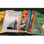 Collection of various children's soft and hardback story books including Tintin, Asterix and