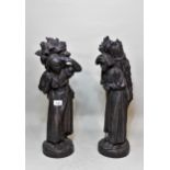 Pair of 19th Century dark patinated spelter figures of female figures carrying bundles of fire