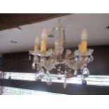 Two modern Venetian style chandeliers, one with clear glass arms, the other with blue glass arms