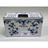 18th Century Delft blue and white flower brick, 15cms wide (damages)