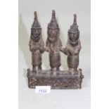 Small Benin bronze group of three standing figures on a plinth base, 19.5cms high