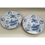 Pair of 18th / 19th Century Dutch Delft blue and white circular deep dishes decorated in oriental