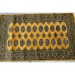 Pakistan rug of Turkoman design with two rows of gols on a beige ground, 153cms x 90cms