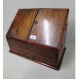 Victorian walnut slope front stationery cabinet with two doors enclosing a fitted interior above a