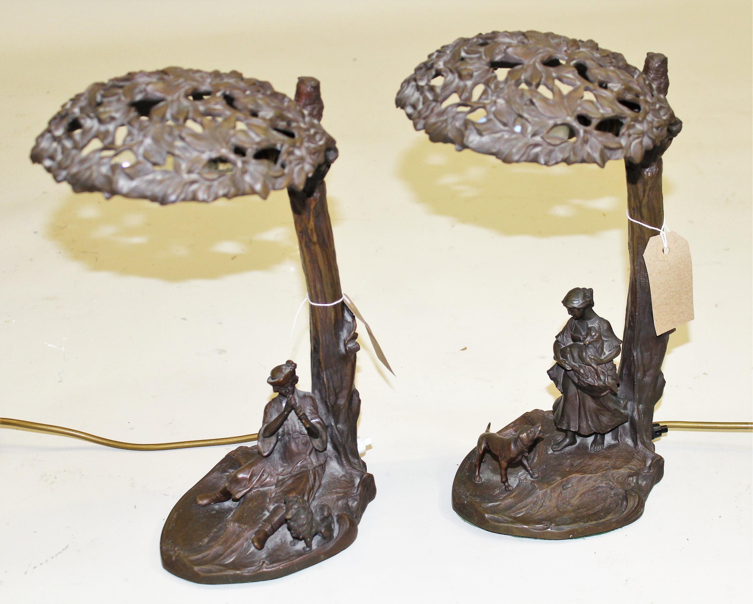 Pair of early 20th Century Continental dark patinated bronze table lamps in the form of figures,