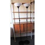 Pair of modern black painted and composite uplighters, 174cms high