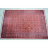 Modern Afghan Belouch carpet with three rows of six gols on wine ground with borders, 300cms x